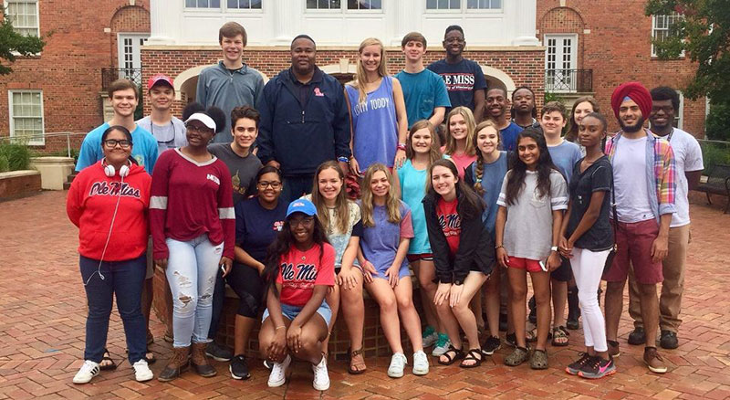 Group photo of students in front of Lott Leadership Institute building