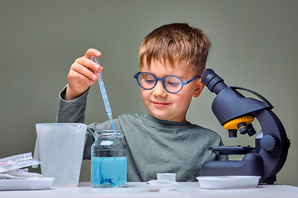 boy with microscope