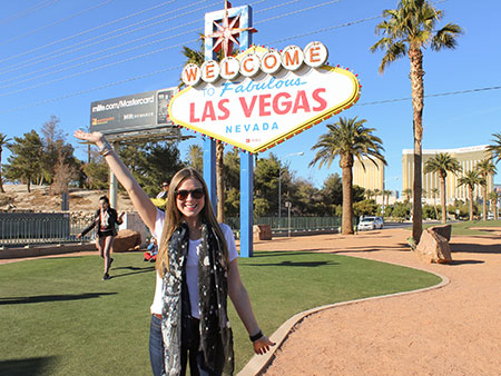 Study USA student posing in front of the Las Vegas welcome sign