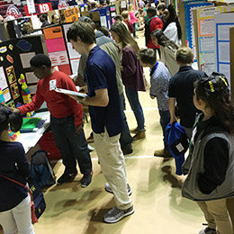 Students on the floor of the lower fair