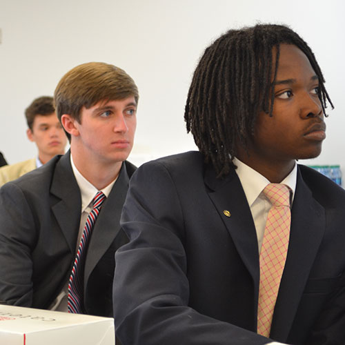 Leadership students in classroom listening intently