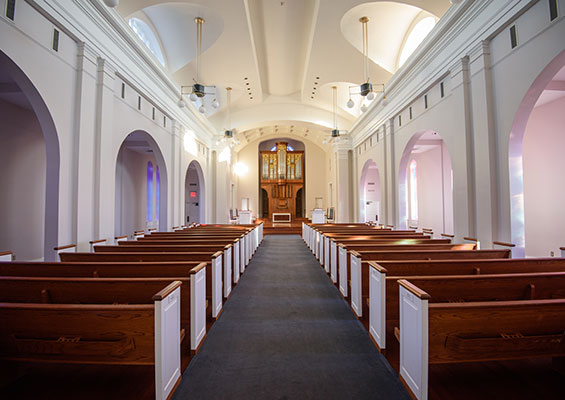 Aisle of Chapel with pipe organ