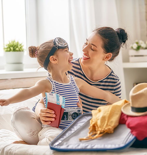 mother and daughter packing for trip