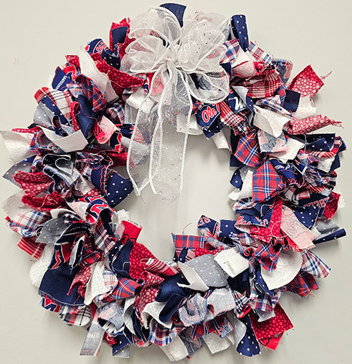 Wreath made with red, white, and blue fabric strips