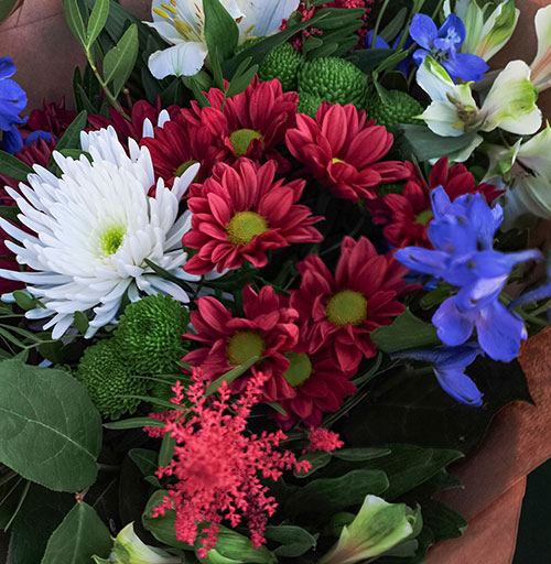 arrangement of flowers in Ole Miss red and blue colors