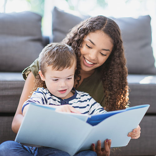 Babysitter reading to a child