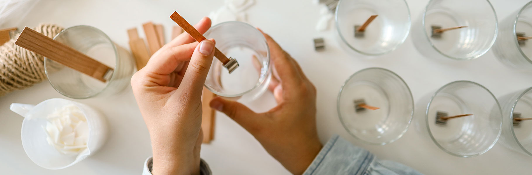 hands assembling a casserole dish full of tamales
