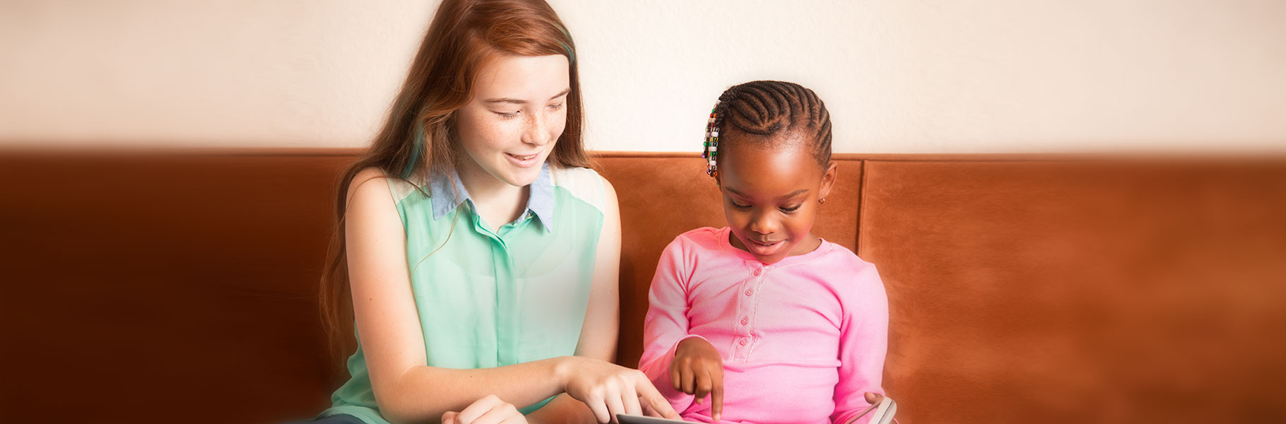 baby sitter and child reading
