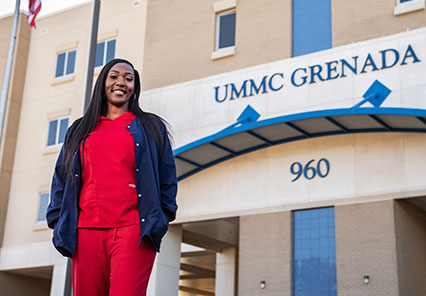 Grenada grad LaTosha Whaley in front of UMMC Grenada center