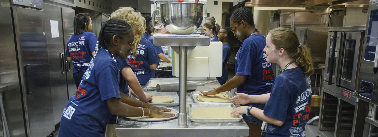 Cooking camp students making pizza