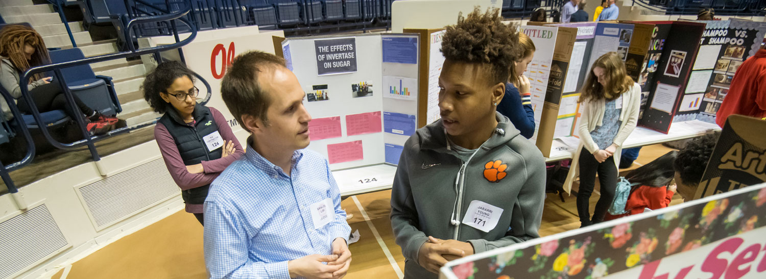 science fair judge and student