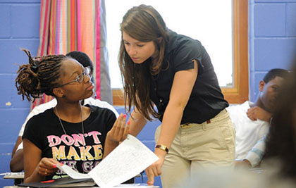 teacher and student in classroom