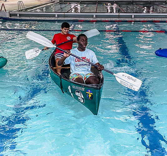Students learning kayaking in pool