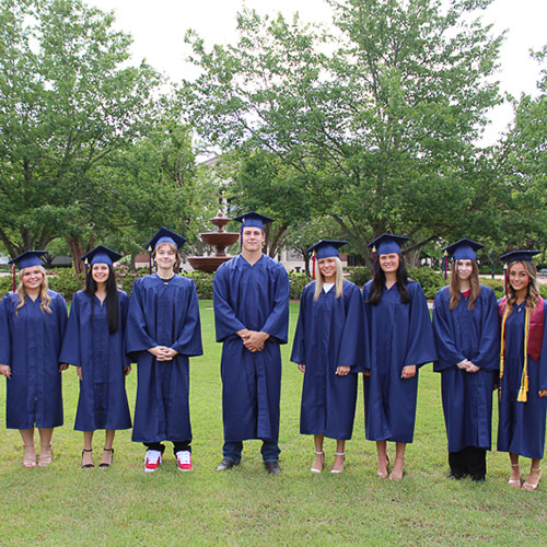 UMHS Graduates in caps and gowns in UM Quad