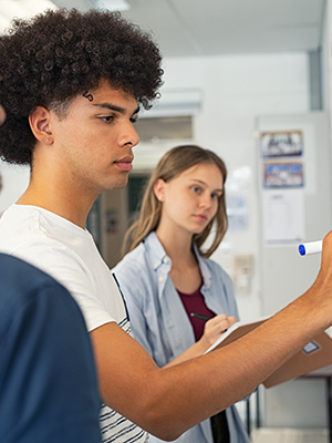Students at white board