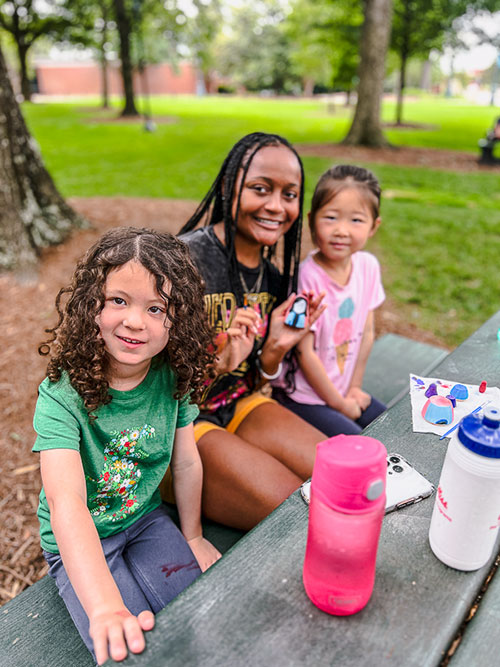 Camp counselor with students during rebel quest