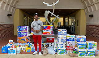 Jalen Wells with supplies he raised funds for