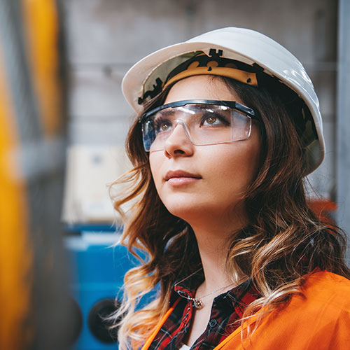 Female Student wearing safety gear in a lab