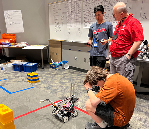 two Students working on robotics project