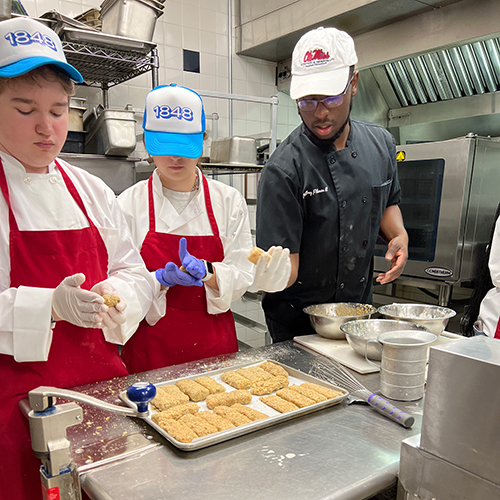 Students working in kitchen