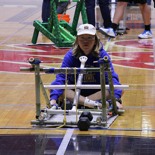 Catapult Competition participants testing catapult