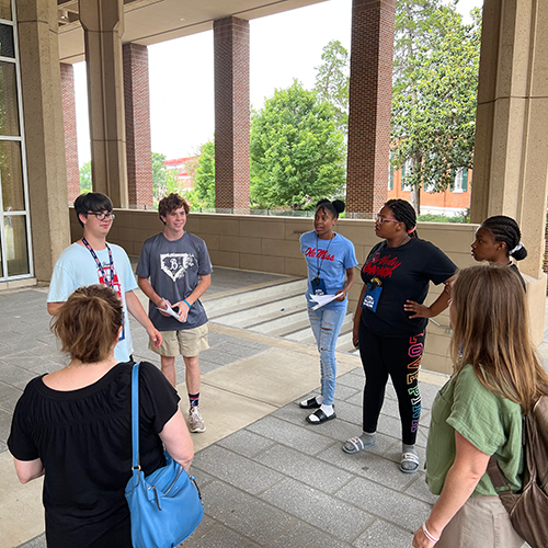 Students outside residence hall on campus