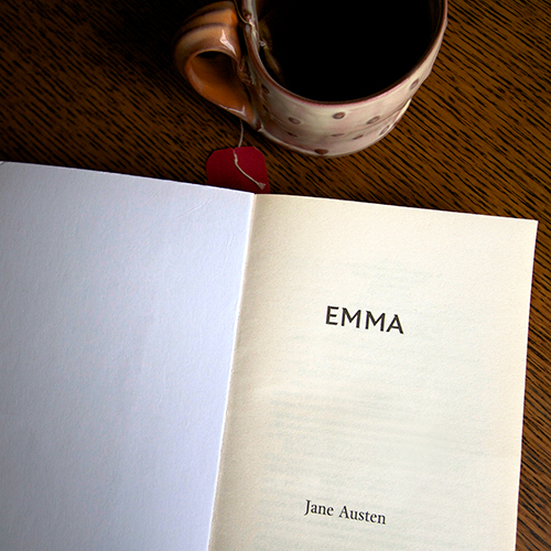 book opened to page of emma by jane austen