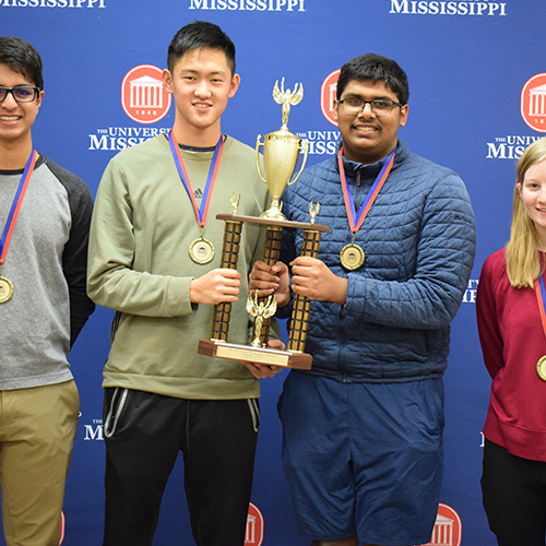 Quiz tournament winners with trophy