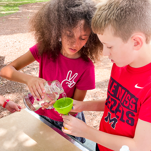 Two Rebel Quest Students working on project together