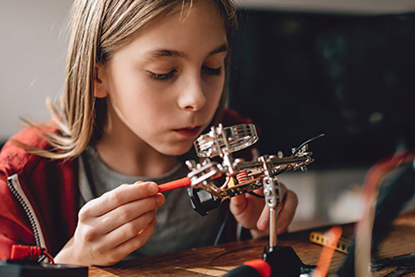 Child working on robotics project