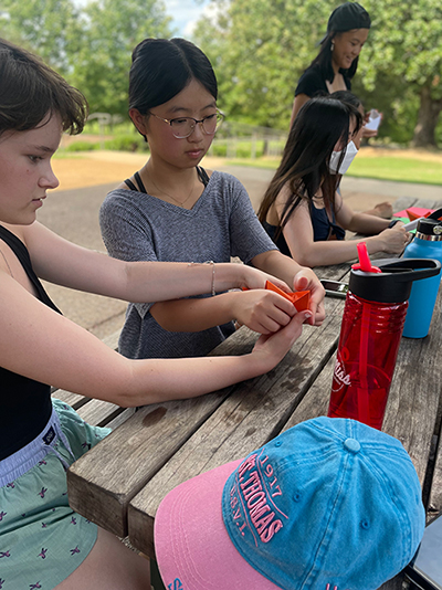 StarTalk students outdoors working on a project