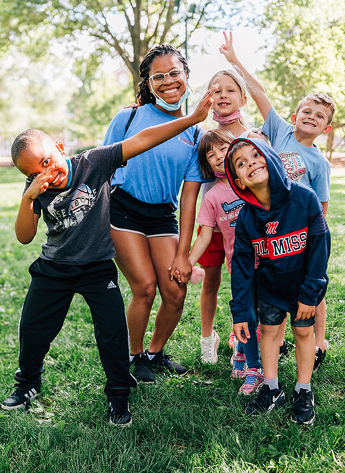 Students and counselor on campus during rebel quest