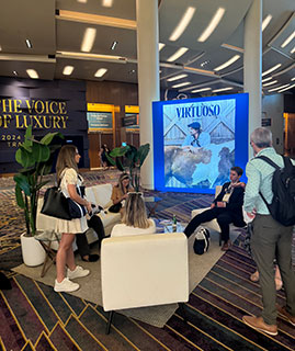 Students at conference talking in lounge area