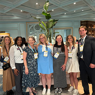 group of students posing at conference