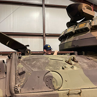 student inside tank at WW2 museum