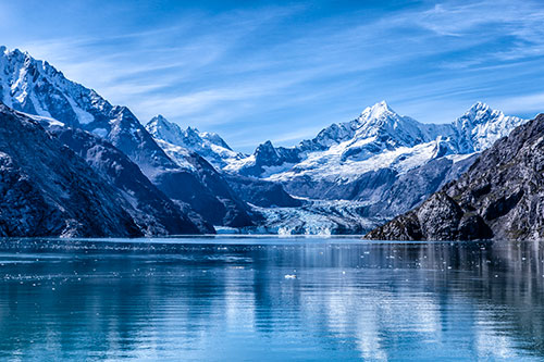 Snow-covered Mountains in Alaska surrounding bay