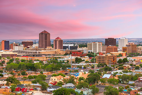 Cityscape of Albuquerque New Mexico in pink sunset light