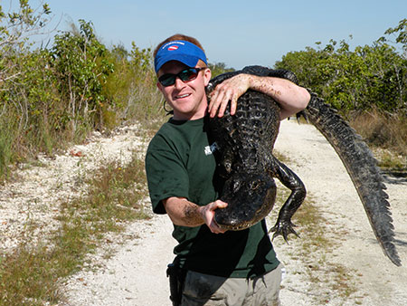 Student holding reptile during Study USA course