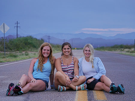 Students posing in road near Las Vegas, Nevada
