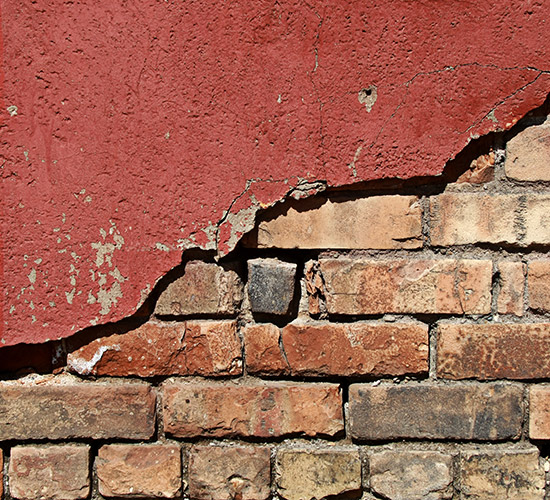 brick with breaking stucco
