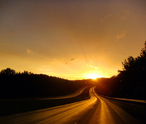 Sunset over a four lane southern highway