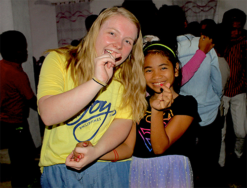 Wallace with student in Phillipines