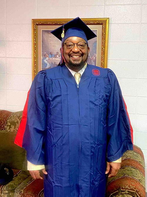 Kirkendall in commencement robes